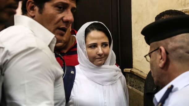 Aya Hijazi, center, a dual U.S.-Egyptian citizen, is acquitted by an Egyptian court after nearly three years of detention over accusations related to running a foundation dedicated to helping street children, Cairo, Sunday,  April 16, 2017. Egyptian authorities arrested Hijazi, her husband and six others in May 2014 on charges of abusing children in her care and engaging in human trafficking, kidnapping, sexual exploitation and torture. (AP Photo/Mohamed el Raai)