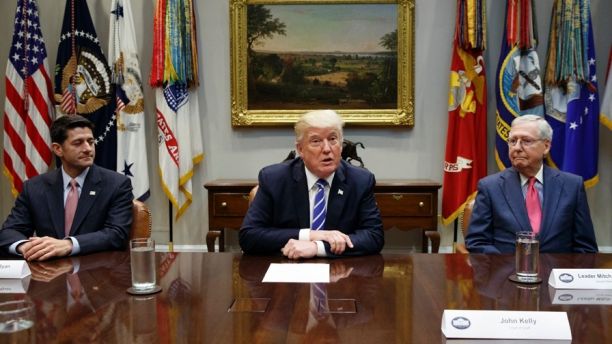FILE - In this Sept. 5, 2017, file photo, House Speaker Paul Ryan, R-Wis., left, and Senate Majority Leader Mitch McConnell, R-Ky., right, listen as President Donald Trump speaks during a meeting with Congressional leaders and administration officials on tax reform, in the Roosevelt Room of the White House in Washington. Taxes, spending, immigration, and more, top a daunting agenda when Congress returns to Washington on Monday, Nov. 27, 2017. ItÃ¢â¬â¢s a critically important moment for the president and his GOP allies controlling Congress, who are still reaching for their first major Capitol Hill win. Tax cuts would fit the bill. (AP Photo/Evan Vucci, File)