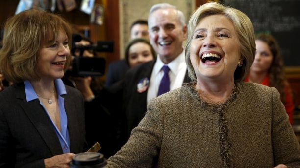 U.S. Democratic presidential candidate Hillary Clinton greets people at Mapps Coffee in Minneapolis, Minnesota March 1, 2016. Also pictured are Minnesota Lt. Governor Tina Smith (L) and Governor Mark Dayton (2nd R). REUTERS/Jonathan Ernst - GF10000329664