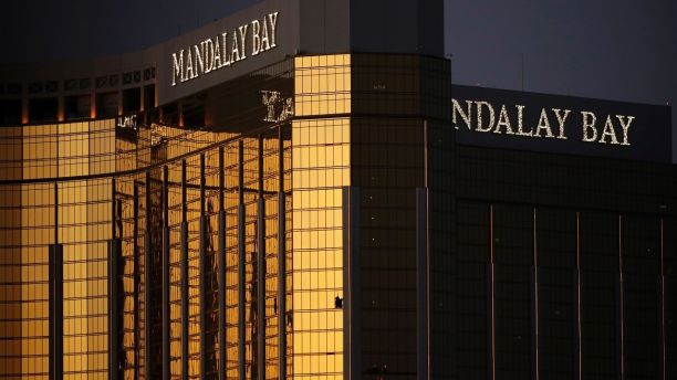 FILE - In this Oct. 3, 2017, file photo, windows are broken at the Mandalay Bay resort and casino in Las Vegas. Authorities said Stephen Craig Paddock broke the windows and began firing with a cache of weapons, killing dozens and injuring hundreds. Attorneys for a California woman wounded in the Oct. 1 mass shooting that killed 58 and left hundreds injured on the Las Vegas Strip have dropped a gun accessories maker from her negligence and damages lawsuit. One of Rachel Sheppard's lawyers, Craig Eiland, said Thursday, Dec. 7, 2017, the decision to strip Slide Fire Solutions from the case lets him focus claims against hotel owner MGM Resorts International and concert promoter Live Nation Entertainment. (AP Photo/John Locher, File)