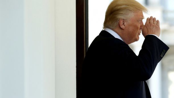 FILE PHOTO:U.S President Donald Trump salutes a Marine during a departure from the West Wing of the White House in Washington, U.S., May 16, 2017. REUTERS/Joshua Roberts/Files - RTX3CZXI