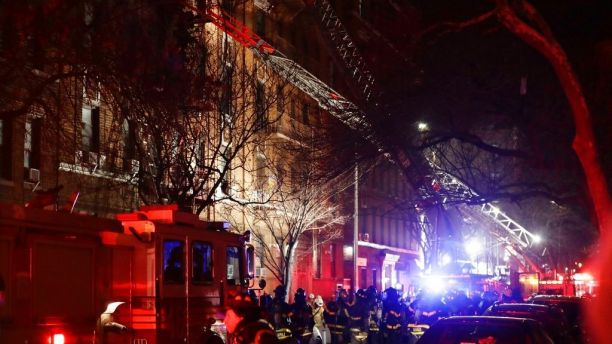 Firefighters respond to a building fire Thursday, Dec. 28, 2017, in the Bronx borough of New York. The Fire Department of New York says a blaze raging in the Bronx apartment building has seriously injured more than a dozen of people. (AP Photo/Frank Franklin II)
