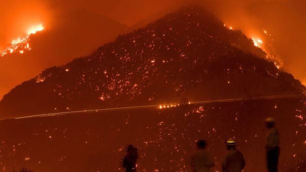 Firefighters monitor the Thomas fire as it burns through Los Padres National Forest near Ojai, Calif., on Friday, Dec. 8, 2017. (AP Photo/Noah Berger)