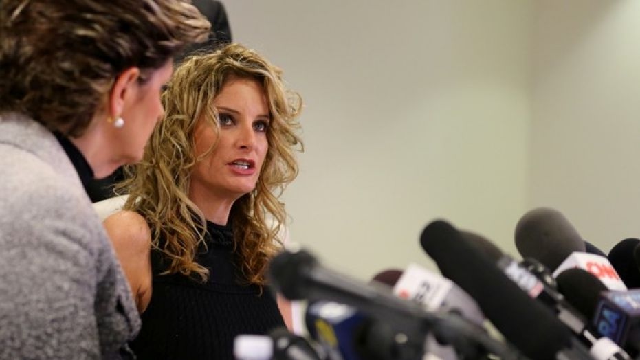 Summer Zervos speaks as her attorney Gloria Allred looks on during a news conference announcing the filing of a lawsuit against President-elect Donald Trump in Los Angeles, California, U.S., January 17, 2017. REUTERS/Mike Blake - RC12FB15AF20