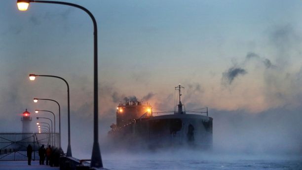 Steam rises from Lake Superior as the ship St. Clair comes to harbor during some of the coldest temps of the year, Sunday, Dec. 31, 2017, at Canal Park in Duluth, Minn. The St. Clair is a self-unloader built in 1976 at Sturgeon Bay, Wis., and is 770 feet long and has 26 hatches that open into 5 cargo holds, providing a load capacity of 45,000 tons. (David Joles/Star Tribune via AP)