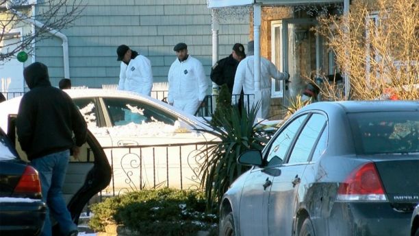 Authorities investigate outside a home in Long Branch, N.J., Monday, Jan. 1, 2018. A 16-year-old has been arrested after his parents, sister and a family friend were found dead inside the home where they lived, authorities said Monday. (Thomas P. Costell/The Asbury Park Press via AP)