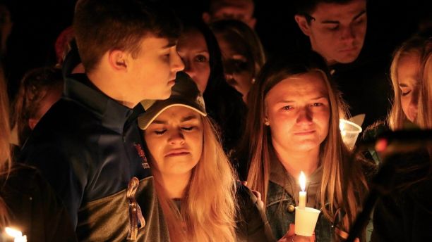 People attend a vigil for the victims of a fatal shooting at Marshall County High School on Thursday, Jan. 25, 2018, at Mike Miller County Park in Benton, Ky. The 15-year-old accused of the fatal shooting on Tuesday, which left over a dozen injured, was ordered held Thursday on preliminary charges of murder and assault. (AP Photo/Robert Ray)