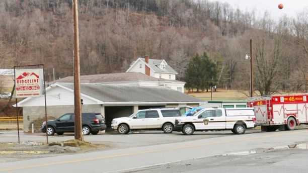 Officers work on the scene of a fatal shooting at a car wash in Melcroft, Pa., Sunday, Jan. 28, 2018. (Michael Palm/Herald-Standard via AP)