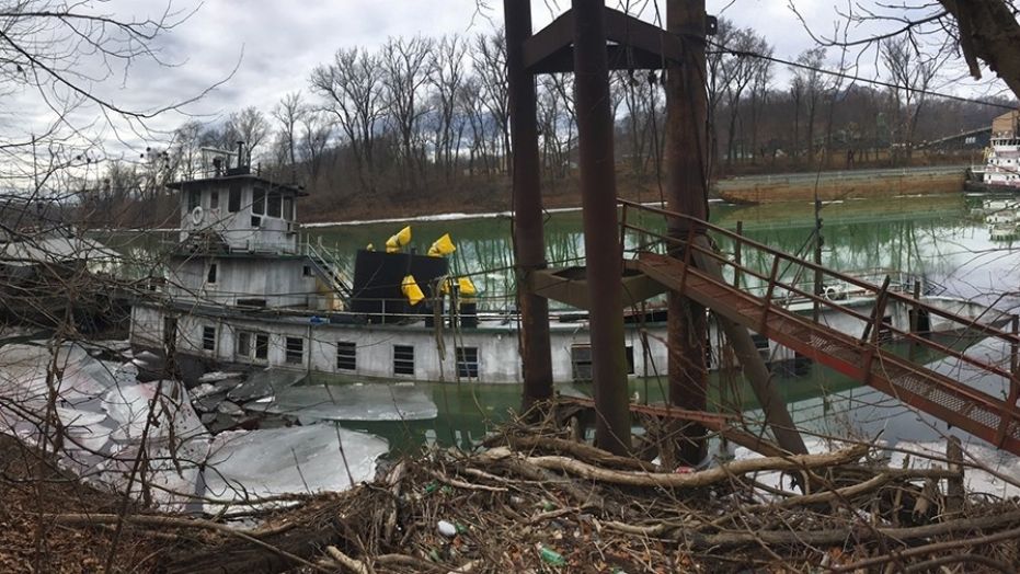 Coast Guard Marine Safety Unit Huntington members are responding to a sunken vessel with reports of discharging product near mile marker 8 on the Big Sandy River near Butler, W.V., on Wednesday