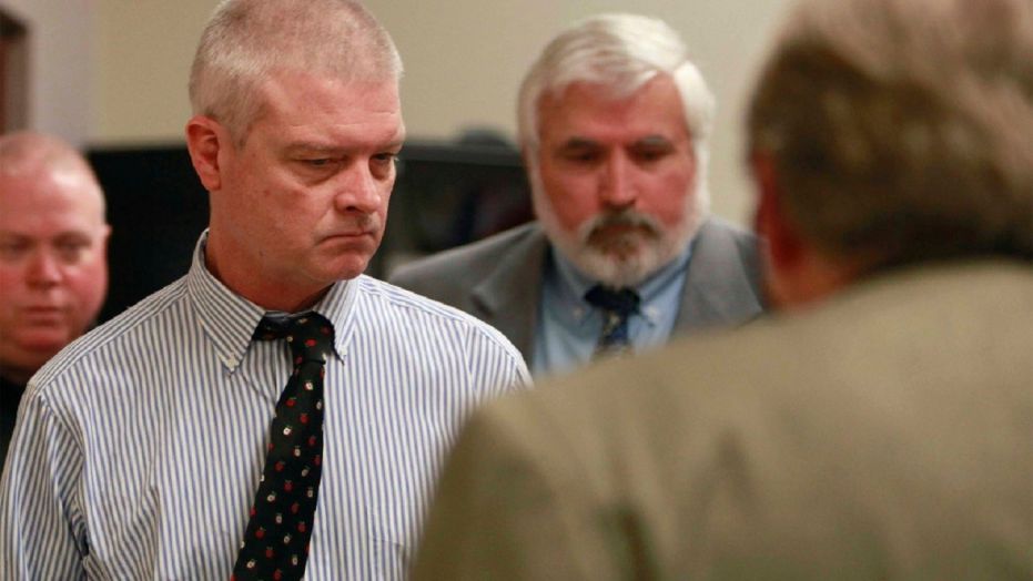Craig Michael Wood (L) enters the courtroom for a hearing in Springfield, Mo., March 26, 2014. Wood is charged with first-degree murder, armed criminal action, child kidnapping, rape and sodomy in connection with 10-year-old Hailey Owens' death in February of 2014.
