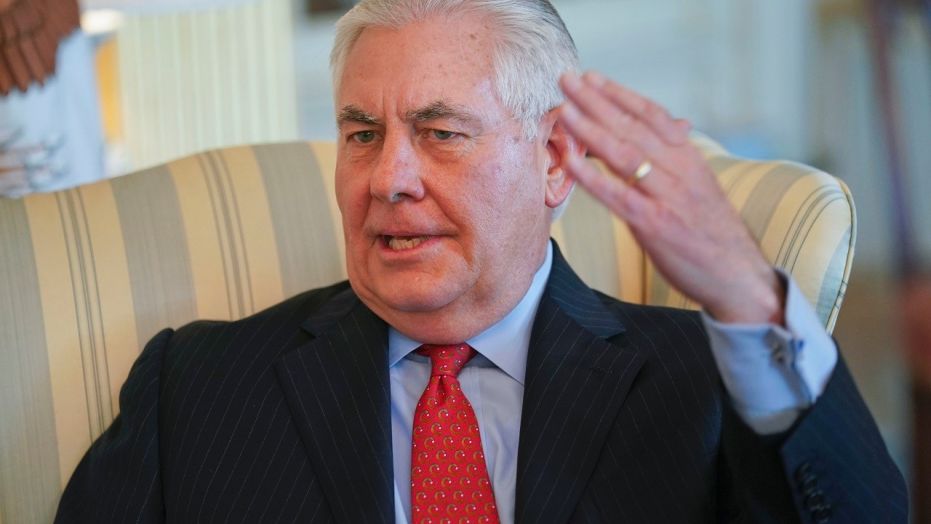 Secretary of State Rex Tillerson gestures during a interview with the Associated Press at the State Department in Washington, Jan. 5, 2018. Tillerson says the Trump administration is working on a legislative fix that could clear the path to remain in the Iran nuclear deal.