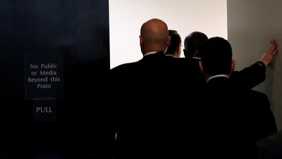 Deputy U.S. Attorney General Rod Rosenstein enters the U.S. Senate's Sensitive Compartmented Information Facility (SCIF) with his security detail to brief the full Senate on details of President Trump's firing of FBI Director James Comey.