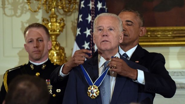 President Barack Obama presents Vice President Joe Biden with the Presidential Medal of Freedom during a ceremony in the State Dining Room of the White House in Washington, Thursday, Jan. 12, 2017. (AP Photo/Susan Walsh)