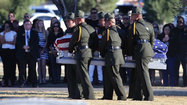 Border Patrol pallbearers carry Border Patrol agent Rogelio Martinez to a graveside service at Restlawn Cemetery, Saturday, Nov. 25, 2017 in El Paso, Texas. Martinez was on patrol in the Big Bend Sector when he died in the line of duty. (Mark Lambie/The El Paso Times via AP)