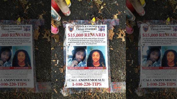 FILE - In this Sept. 27, 2016 file photo, a poster featuring photos of Nisa Mickens and Kayla Cuevas is part of a memorial near the spot where their bodies were found in Brentwood, N.Y. Mickens, 15, and Cuevas, 16, both students at Brentwood High School, were beaten and hacked to death by a carload of gang members who spotted them walking down the street. Investigators said Cuevas had been feuding verbally with gang members. President Donald Trump is scheduled travel to New York on Friday, July 28, to meet with law enforcement on Long Island and discuss the MS-13 street gang. (AP Photo/Claudia Torrens, File)