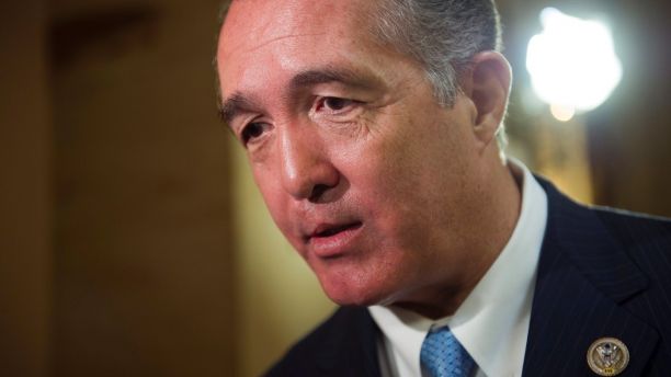 FILE - In this March 24, 2017, file photo, Rep. Trent Franks, R-Ariz. speaks with a reporter on Capitol Hill in Washington. Franks says he is resigning Jan. 31 amid a House Ethics Committee investigation of possible sexual harassment. Franks says in a statement that he never physically intimidated, coerced or attempted to have any sexual contact with any member of his congressional staff. Instead, he says, the dispute resulted from a discussion of surrogacy. Franks and his wife have 3-year-old twins who were conceived through surrogacy. (AP Photo/Cliff Owen, File)