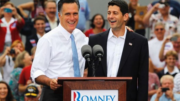 Republican U.S. Presidential candidate Mitt Romney (L) introduces U.S. Congressman Paul Ryan (R-WI) as his vice-presidential running mate during a campaign event at the retired battleship USS Wisconsin in Norfolk, Virginia, August 11, 2012.  REUTERS/Jason Reed (UNITED STATES - Tags: POLITICS ELECTIONS) - GM2E88B1OC701
