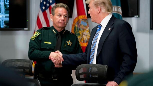 President Donald Trump shakes hands with Broward County Sheriff Scott Israel as he meets with law enforcement officers at Broward County Sheriff's Office in Pompano Beach, Fla., Friday, Feb. 16, 2018, following Wednesday's shooting at Marjory Stoneman Douglas High School, in Parkland, Fla. (AP Photo/Andrew Harnik)