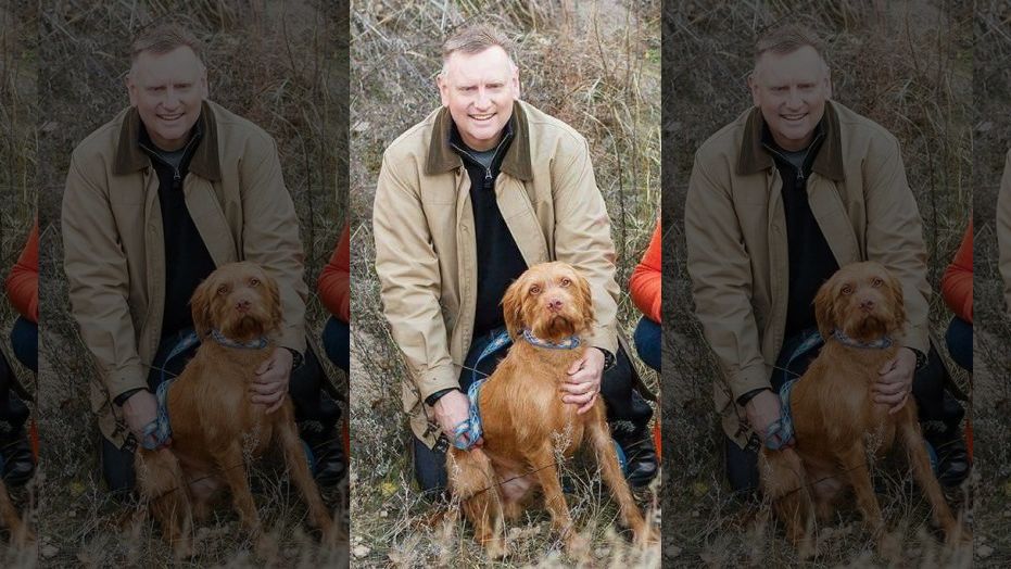 Terran Woolley with Angus P. Woolley, the dog.