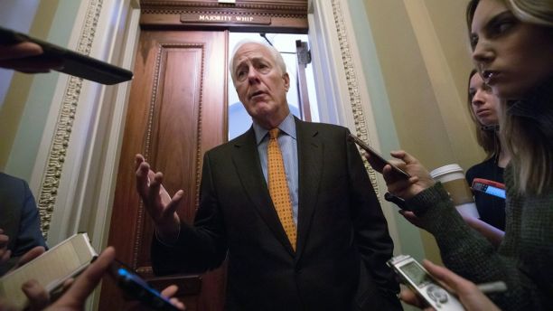 With no apparent indications of a breakthrough in the Senate to avoid a government shutdown, Majority Whip John Cornyn, R-Texas, speaks briefly with reporters outside his office on Capitol Hill in Washington, Friday, Jan. 19, 2018. (AP Photo/J. Scott Applewhite)