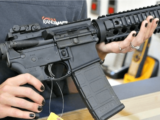 Woman-Holds-AR-15-Rifle-