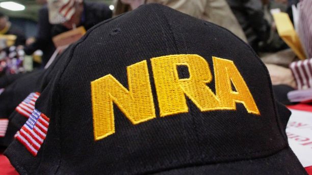 FILE- In this March 7, 2012 file photo, Illinois gun owners and supporters file out National Rifle Association applications while participating in an Illinois Gun Owners Lobby Day convention before marching to the Illinois state Capitol in Springfield, Ill. Hearing aid maker Starkey Hearing Technologies is joining other companies that have cut ties with the National Rifle Association after the latest school massacre. (AP Photo/Seth Perlman, File)