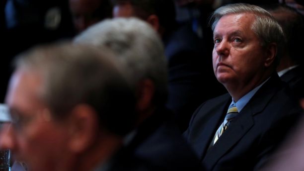 U.S. Senator Lindsey Graham (R-SC) listens as President Donald Trump speaks during a bipartisan meeting with legislators on immigration reform at the White House in Washington, U.S. January 9, 2018.  REUTERS/Jonathan Ernst - RC1AEE40D720