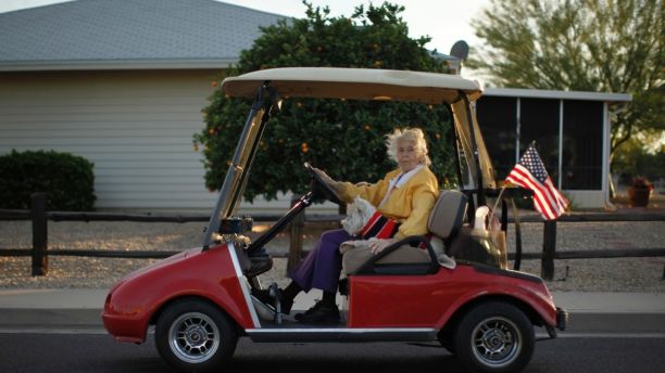 A woman rides in a golf cart with her dog in Sun City, Arizona, January 6, 2013. Sun City was built in 1959 by entrepreneur Del Webb as America?s first active retirement community for the over-55's. Del Webb predicted that retirees would flock to a community where they were given more than just a house with a rocking chair in which to sit and wait to die. Today?s residents keep their minds and bodies active by socializing at over 120 clubs with activities such as square dancing, ceramics, roller skating, computers, cheerleading, racquetball and yoga. There are 38,500 residents in the community with an average age 72.4 years. Picture taken January 6, 2013. REUTERS/Lucy Nicholson (UNITED STATES - Tags: SOCIETY)
ATTENTION EDITORS - PICTURE 16 OF 30 FOR PACKAGE 'THE SPORTY SENIORS OF SUN CITY'
SEARCH 'SUN CITY' FOR ALL IMAGES - LM2E91F0XAN01
