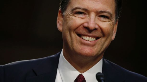 Former FBI Director James Comey testifies before a Senate Intelligence Committee hearing on