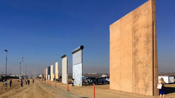 FILE - This Oct. 26, 2017 file photo shows prototypes of border walls in San Diego. A federal judge in San Diego who was taunted by Donald Trump during the presidential campaign has sided with the president on a challenge to building a border wall with Mexico. U.S. District Judge Gonzalo Curiel on Tuesday, Feb. 27, 2018 rejected arguments by the state of California and advocacy groups that the administration overreached by waiving laws requiring environmental and other reviews before construction could begin. (AP Photo/Elliott Spagat, File)