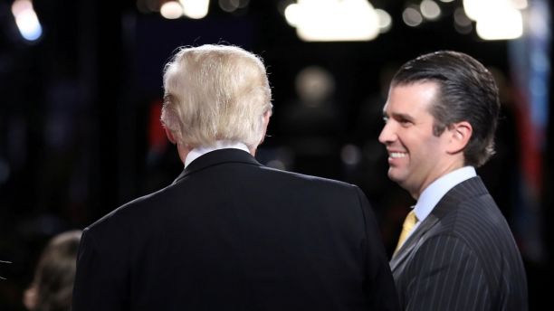 Republican U.S. presidential nominee Donald Trump (L) talks with his son Donald Trump Jr. (R) after his debate against Democratic nominee Hillary Clinton at Hofstra University in Hempstead, New York, U.S. September 26, 2016.  REUTERS/Joe Raedle/POOL - RC1687AB1960