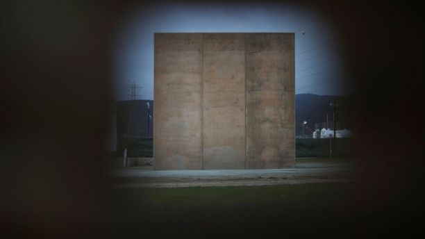 A prototype for U.S. President Donald Trump's border wall with Mexico is seen through a hole in the the current border fence, in this picture taken from the Mexican side of the border in Tijuana, Mexico March 12, 2018. REUTERS/Edgard Garrido - RC11C9B77430