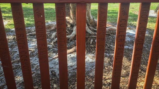 February 23, 2018 - Parkland, Florida USA: The names of suspected Florida gunman Nikolas Cruz and his brother Zachary Cruz appear in two slats in the fence surrounding a playground at Liberty Park, 9200 Ranch Road, Parkland, Fl. Friday, February 23, 2018. (Juan Ortega/Sun Sentinel/POLARIS) ///
